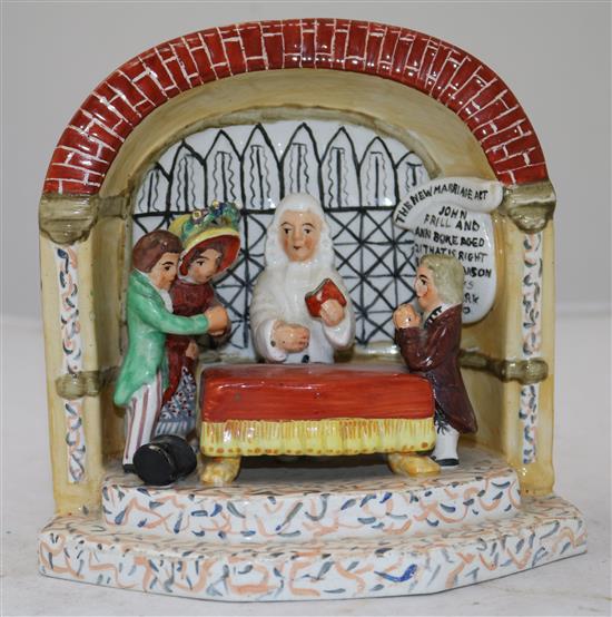 A Staffordshire The New Marriage Act pottery group, c.1840, 15cm